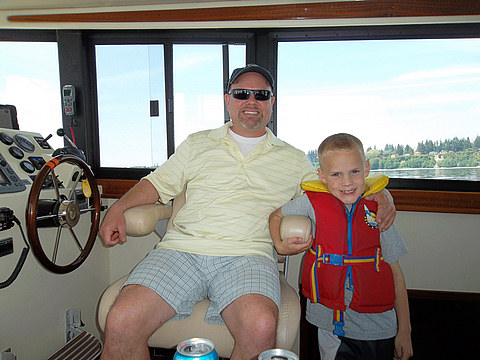 Philip at the Helm with Caden